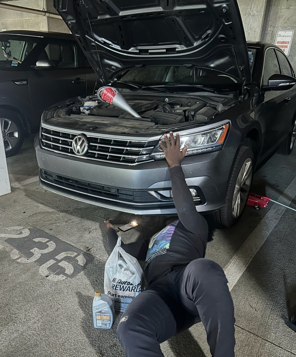 Technician performing a pre-purchase diagnostic scan on a used vehicle