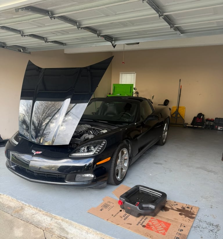 Pickup truck transmission being serviced
