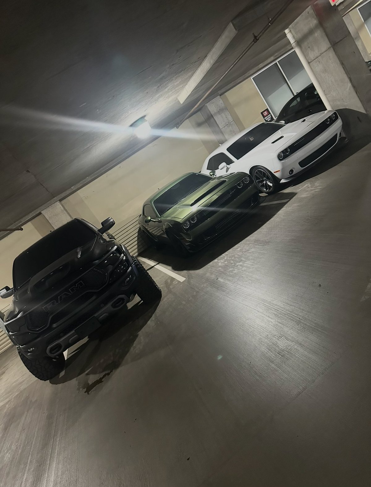 Performance vehicles in a garage ready for tuning